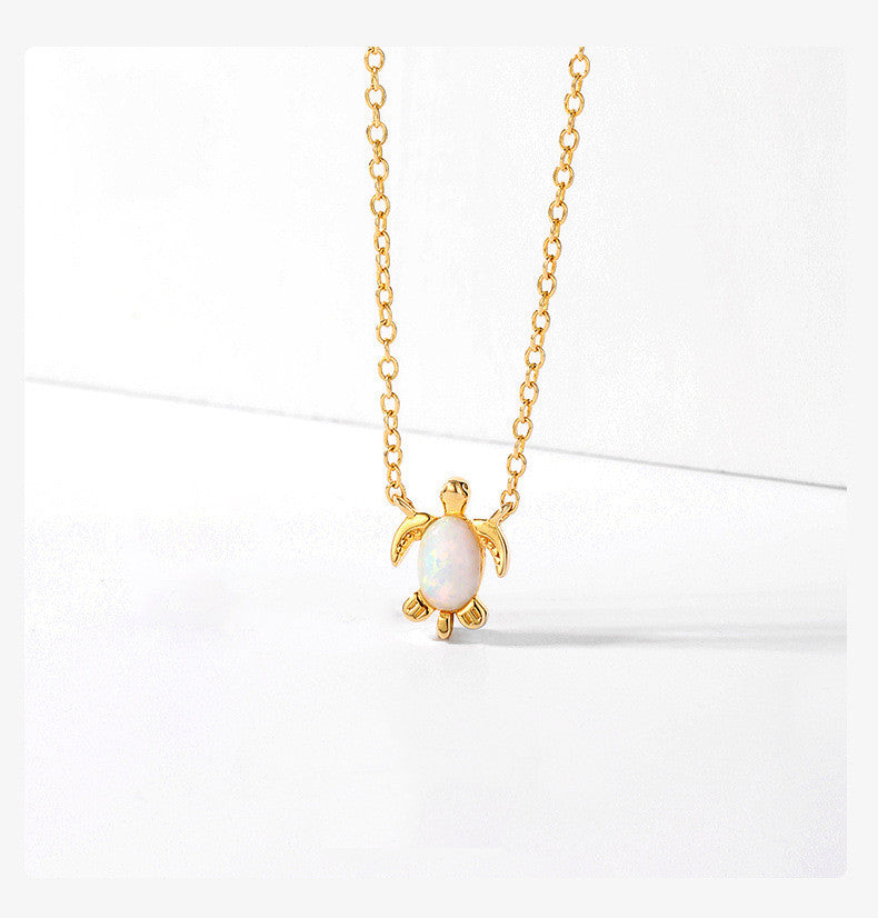 white turtle necklace